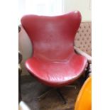 A vintage mid Century wing back leatherette egg chair on chrome base