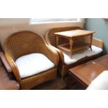 A cane conservatory two seater sofa,