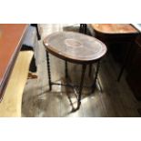 An early 20th Century barley twist mahogany occasional table with bergere top