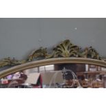 A substantial painted overmantel mirror with etched glass decoration