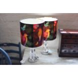 A pair of modern perspex table lamps with tropical bird decorated shades