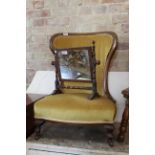 A late 19th Century mahogany nursing chair and a small swing mirror