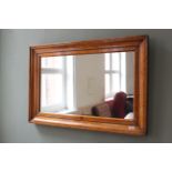 A late 19th Century satin birch framed wall mirror