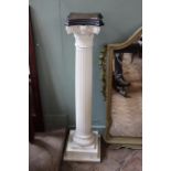 A carved pine painted column plant stand