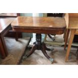 A William IV inlaid mahogany card table with decorative feet and castors