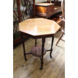 An Edwardian walnut occasional table