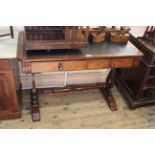 A mid Victorian mahogany two drawer library table with stretcher base with lyre ends