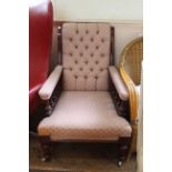 A mid Victorian mahogany upholstered armchair
