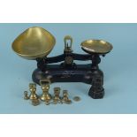 A set of cast iron and brass vintage scales with weights