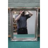 A rectangular silver gilt framed mirror