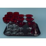 A set of six Czech ruby glass sherry glasses on clear stems plus a set of eight Czech ruby glass