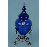 A large Bristol blue glass apothecary/chemist/beverage dispenser lidded jar in metal stand with tap,