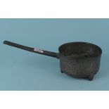 A 17th Century bronze skillet with foundry scratch mark and the reeded handle with continuous