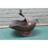 A 19th Century copper helmet coal scuttle and shovel