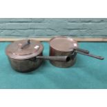 Two 19th Century seamed copper saucepans with lids and iron handles,