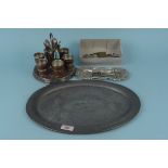 An oval pewter tray, an oak and plated egg stand with six oak and plated egg cups,