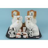 Two pairs of Staffordshire spaniels and five smaller examples