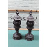 A pair of antique large Chinese bronze censors constructed in three sections,