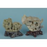 Two Oriental soapstone figures, both with birds,