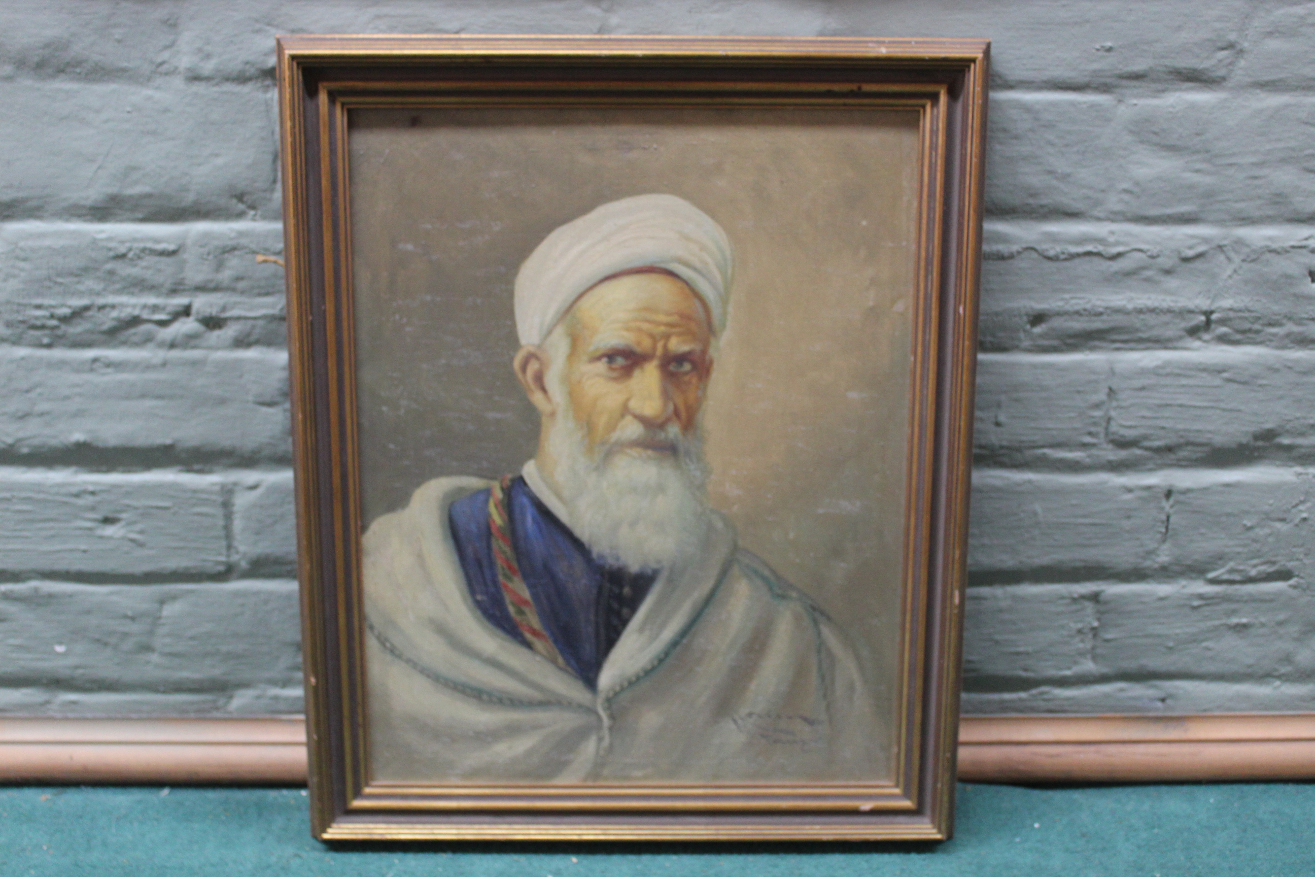 A framed oil portrait on canvas of a Moroccan gentleman, indistinctly signed,