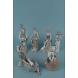 A Nao porcelain figure of a girl with a cat plus five Casades porcelain figurines