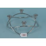 A Georg Jenson white metal four branch candle holder,