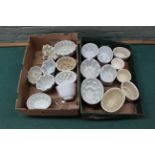 Two boxes with approx nineteen antique jelly moulds in varying sizes and conditions