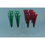 A set of six Czech ruby glass champagne flutes on clear stems with etched holly decoration plus a