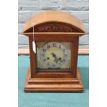 An Edwardian oak cased chiming mantel clock,