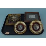 A pair of framed oval miniatures in the Georgian style,