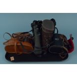 Four pairs of binoculars including Leisure Arts 12x50, Lieberman & Gortz 7x50,