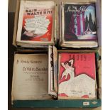 An extensive collection across two boxes of sheet music,
