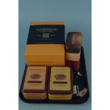 A boxed collection of four Glenmorangie whisky miniatures (10cl) plus three tins