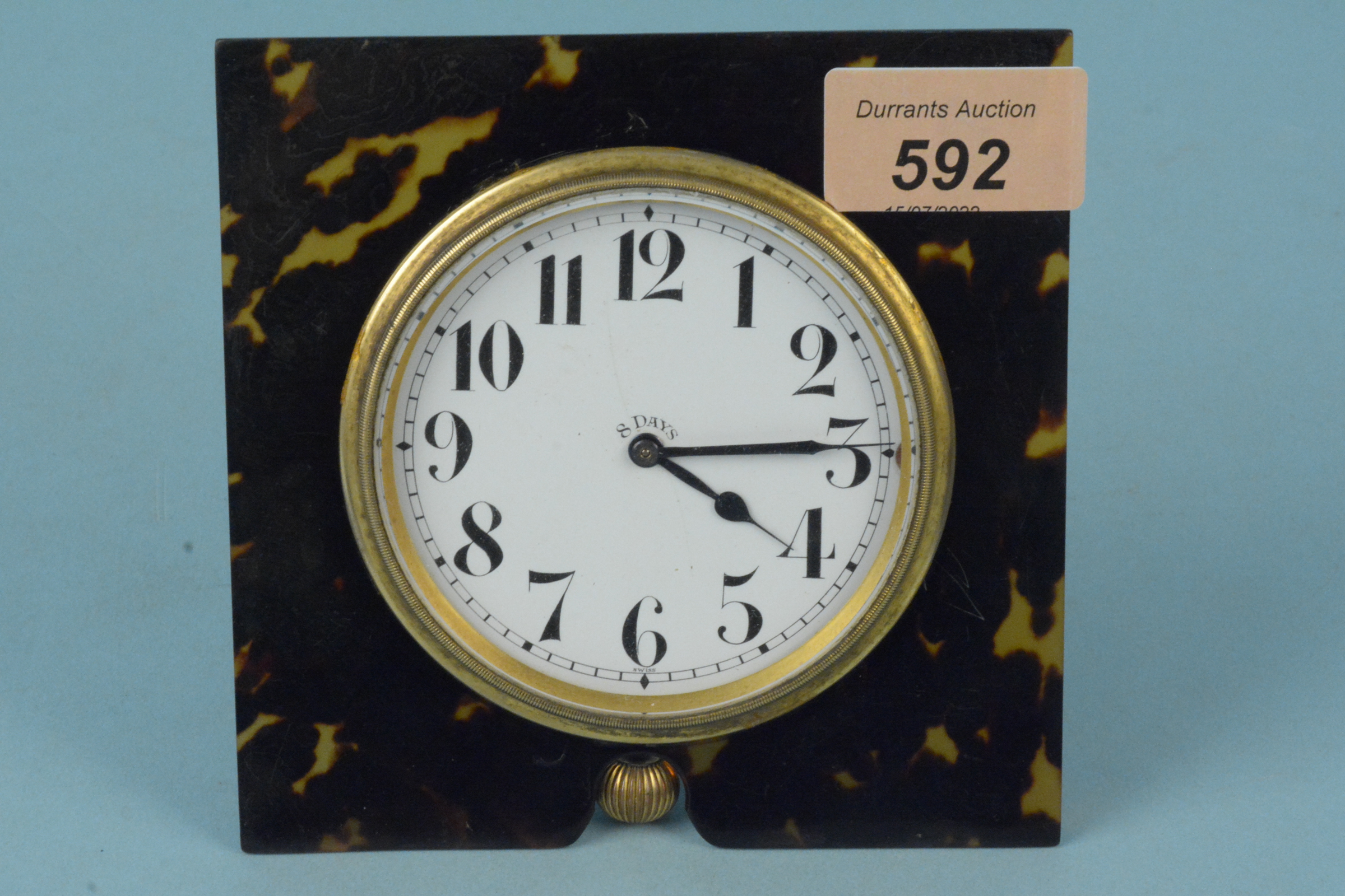 An early 20th Century 'Brevet' 8 day desk clock in tortoiseshell mount