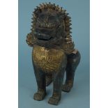 A Chinese bronze and gilded guardian temple lion