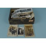 A box of mixed postcards and photographs, mostly early 20th Century, some later copies,