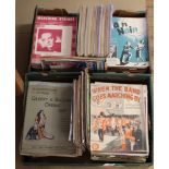 An extensive collection across two boxes of sheet music,