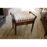 An inlaid mahogany Edwardian upholstered piano stool