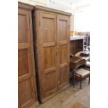 An early Victorian two door pine cupboard