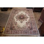 A cream and red ground rug,