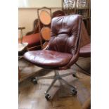 A Gentilina brown leather and chrome chair
