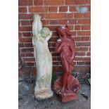 Two garden statues of ladies