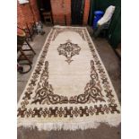 A large Ethiopian cream and brown ground carpet,