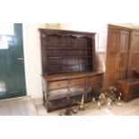 A mid 20th Century oak Georgian style three drawer dresser