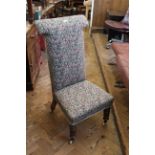 A late Victorian mahogany framed high back upholstered chair