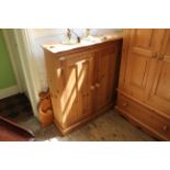 A 20th Century pine two door cupboard