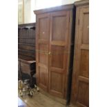 An early Victorian two door pine cupboard