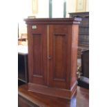 A mahogany two door desk cupboard, marked Habana,