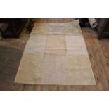 A cream ground wool rug,