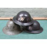 Three WWII helmets